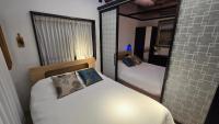 Ein Bett oder Betten in einem Zimmer der Unterkunft Jian Hanok