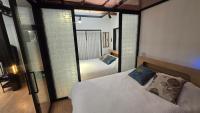 Ein Bett oder Betten in einem Zimmer der Unterkunft Jian Hanok