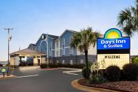 a days inn and suites sign in front of a building at Days Inn &amp; Suites by Wyndham Prattville-Montgomery in Prattville
