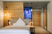 Posteľ alebo postele v izbe v ubytovaní Cyprianerhof Dolomit Resort