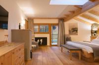 Posteľ alebo postele v izbe v ubytovaní Cyprianerhof Dolomit Resort
