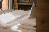 Posteľ alebo postele v izbe v ubytovaní Cyprianerhof Dolomit Resort