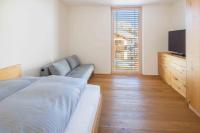 A bed or beds in a room at Krone Apartments Schruns, Top 6/7/8