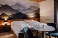 Posteľ alebo postele v izbe v ubytovaní Dorfcafe Unken Hotelpension sWirtshaus im Dorf