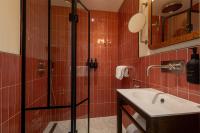 a bathroom with a shower and a sink at NH Copenhagen Grand Joanne in Copenhagen