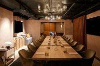 a large conference room with a long table and chairs at NH Copenhagen Grand Joanne in Copenhagen