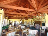 a large room with chairs and tables and wooden ceilings at Visconte Ditalia Hotel e Eventos - Próximo a Gramado in Nova Hartz