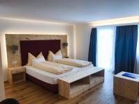 Postel nebo postele na pokoji v ubytování Hotel Conrad