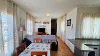 A television and/or entertainment centre at Holiday Apartment Casa Vista Mar Oliastur El Cotillo