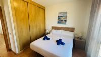 A bed or beds in a room at Holiday Apartment Casa Vista Mar Oliastur El Cotillo