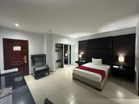 Postel nebo postele na pokoji v ubytování Ramada by Wyndham Princess Santo Domingo