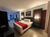 Postel nebo postele na pokoji v ubytování Ramada by Wyndham Princess Santo Domingo
