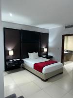 Postel nebo postele na pokoji v ubytování Ramada by Wyndham Princess Santo Domingo