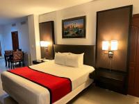 Postel nebo postele na pokoji v ubytování Ramada by Wyndham Princess Santo Domingo