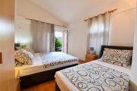 Postel nebo postele na pokoji v ubytování Villa Lilly 3