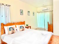 Postel nebo postele na pokoji v ubytování The Golden View Resort สวนผึ้ง