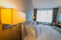 A bed or beds in a room at Yildiz Life Hotel