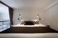 Postel nebo postele na pokoji v ubytování DeZign Superior Apartments & Rooms