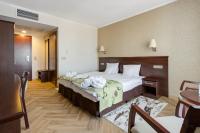 Posteľ alebo postele v izbe v ubytovaní Malinowy Dwór Hotel Medical SPA