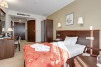 Posteľ alebo postele v izbe v ubytovaní Malinowy Dwór Hotel Medical SPA