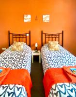 Postel nebo postele na pokoji v ubytování Villa Verano Apartamentos Compartidos Villaverde