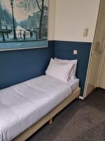 Ein Bett oder Betten in einem Zimmer der Unterkunft Hotel Hoksbergen
