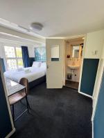 Ein Bett oder Betten in einem Zimmer der Unterkunft Hotel Hoksbergen