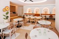 a dining room with white tables and chairs at Hotel Jaime I in Salou