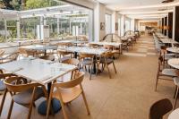 an empty restaurant with tables and chairs at Hotel Jaime I in Salou