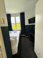 Ein Bett oder Betten in einem Zimmer der Unterkunft Hotel Hoksbergen