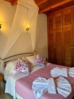 Postel nebo postele na pokoji v ubytování Eros Beach Hotel