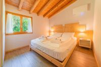 A bed or beds in a room at Piccola Valle