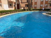 The swimming pool at or close to .Apartamento 1a linea de playa + piscina + parking DAIMUS