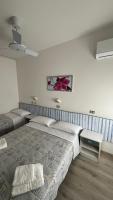 A bed or beds in a room at Hotel Lucerna