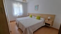 Postel nebo postele na pokoji v ubytování Apartamento Playa De Lariño