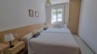 Postel nebo postele na pokoji v ubytování Apartamento Playa De Lariño