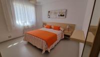 Postel nebo postele na pokoji v ubytování Apartamento Playa De Lariño