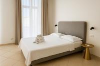 Łóżko lub łóżka w pokoju w obiekcie Garibaldi 118 Luxury Apartment