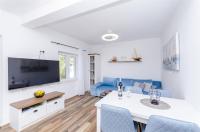 Telewizja i/lub zestaw kina domowego w obiekcie House Kuca za odmor Herta