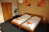 Łóżko lub łóżka w pokoju w obiekcie Hotel Lions Plzen