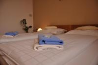 Łóżko lub łóżka w pokoju w obiekcie Hotel Lions Plzen