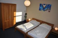 Łóżko lub łóżka w pokoju w obiekcie Hotel Lions Plzen