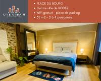 Łóżko lub łóżka w pokoju w obiekcie Le Place Du Bourg Appartement T2 Centre Historique Rodez