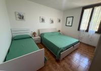 A bed or beds in a room at Casa Katia, Giuliana & Nami