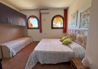 A bed or beds in a room at Casa Katia, Giuliana & Nami