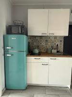 Kuchyň nebo kuchyňský kout v ubytování Apartament Mia