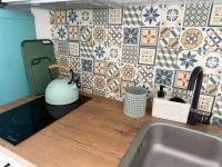 Kuchyň nebo kuchyňský kout v ubytování Apartament Mia