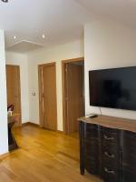 TV a/nebo společenská místnost v ubytování Apartamento Ons Sanxenxo