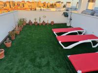 Vonkajšia záhrada v ubytovaní Sunny Luxury Apartment with two great sunny - level terraces, two swimming pools, in a new complex Pueblo Majorero, close to Fuerteventura Golf Club, next to the beach , Atlantico Shopping Mall and casino in Caleta de Fuste