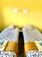 Postel nebo postele na pokoji v ubytování Villa Verano Apartamentos Compartidos Villaverde